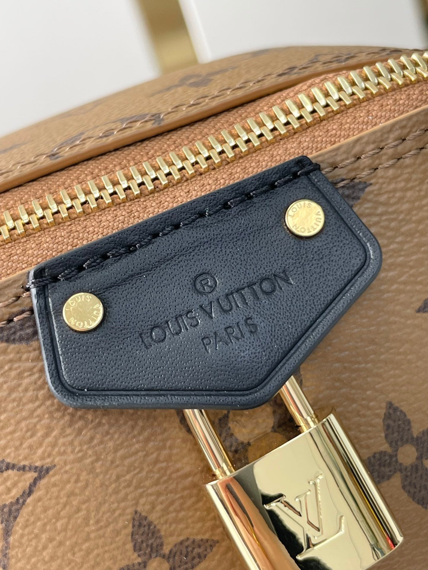 LOUIS VUITTON JUST IN CASE 14 IN BROWN MONOGRAM REVERSE CANVAS GOLD HARDWARE