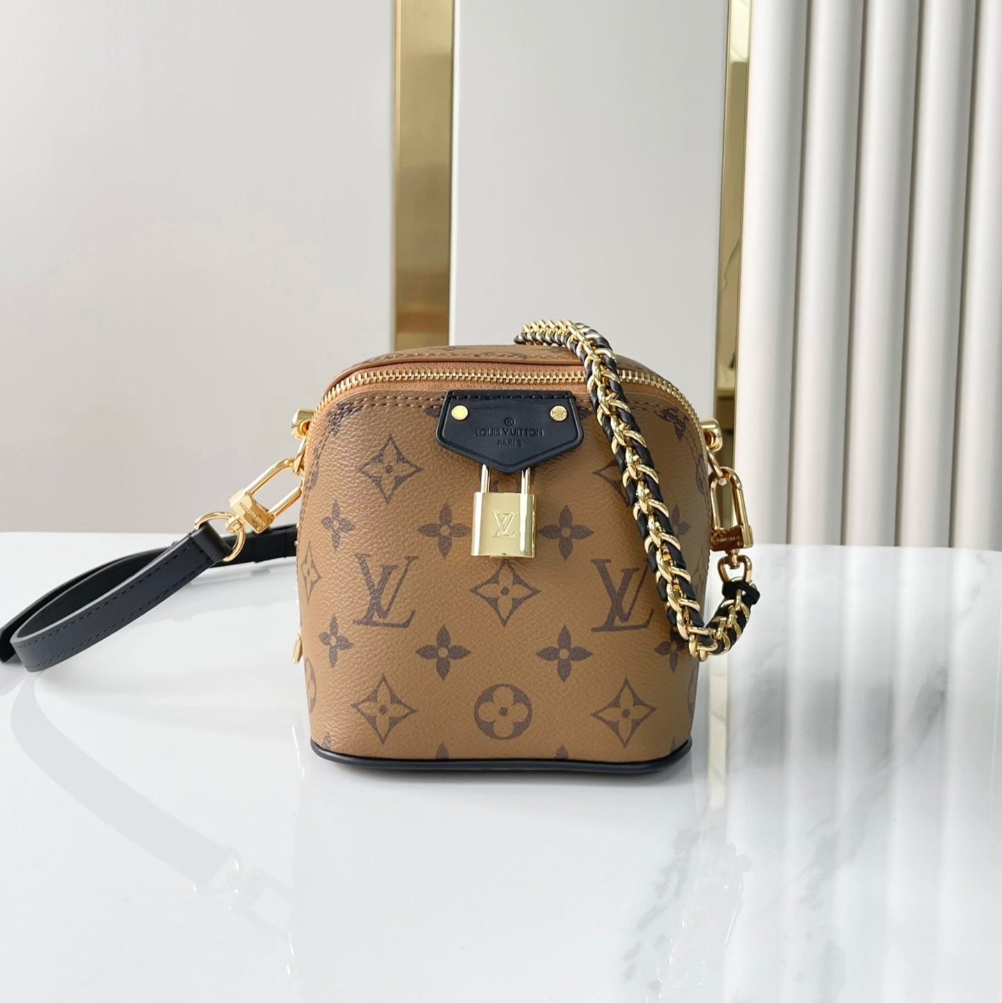 LOUIS VUITTON JUST IN CASE 14 IN BROWN MONOGRAM REVERSE CANVAS GOLD HARDWARE