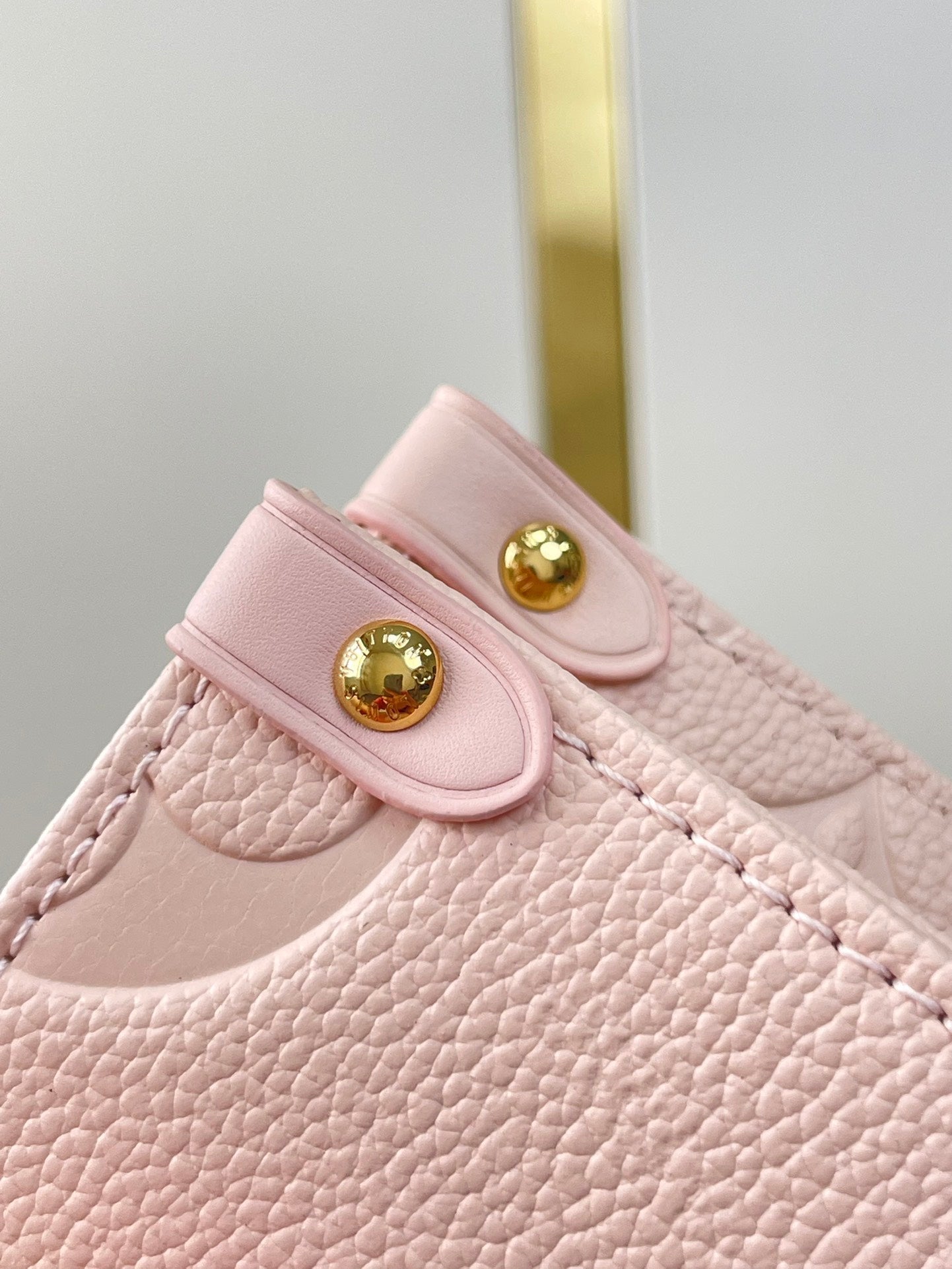 LOUIS VUITTON ONTHEGO PM 25 IN OPALE PINK MONOGRAM EMPREINTE LEATHER