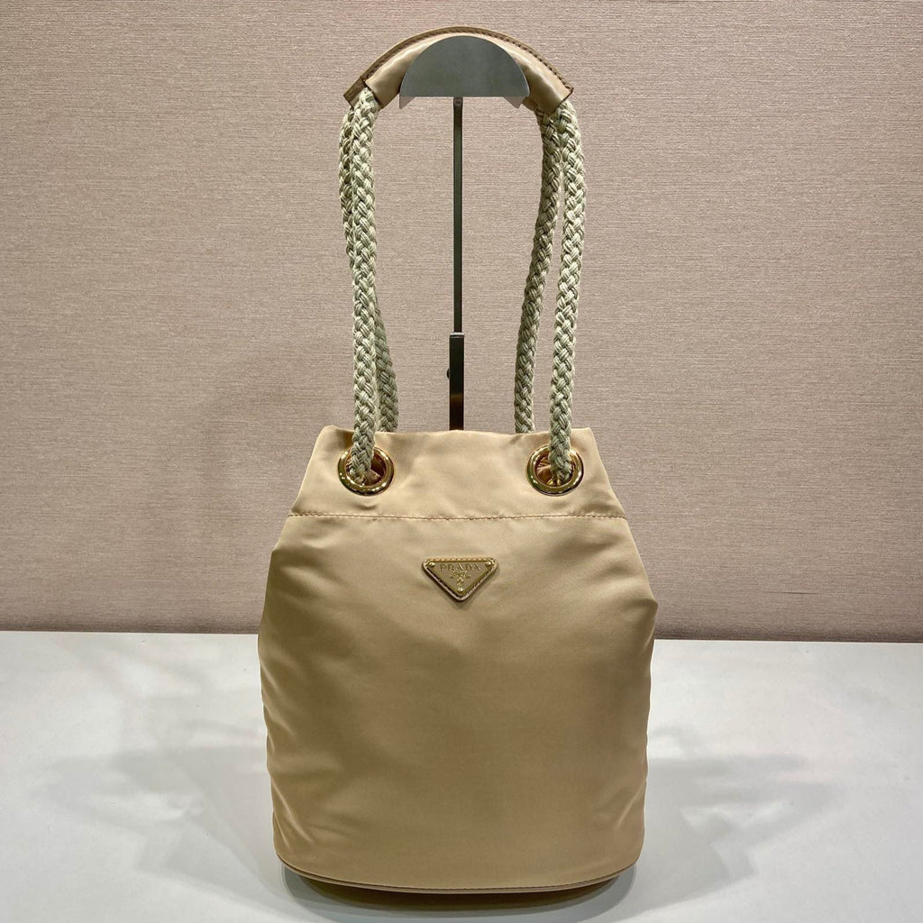 PRADA BUCKET BAG 28 IN BEIGE RE-NYLON GOLD LOGO