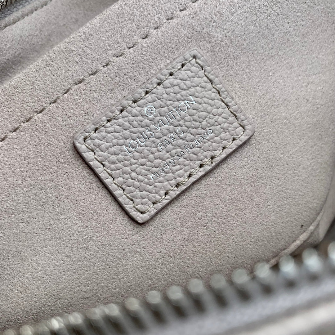 LOUIS VUITTON ONTHEGO EAST WEST BAG 25 IN BICOLOR MONOGRAM EMPREINTE LEATHER