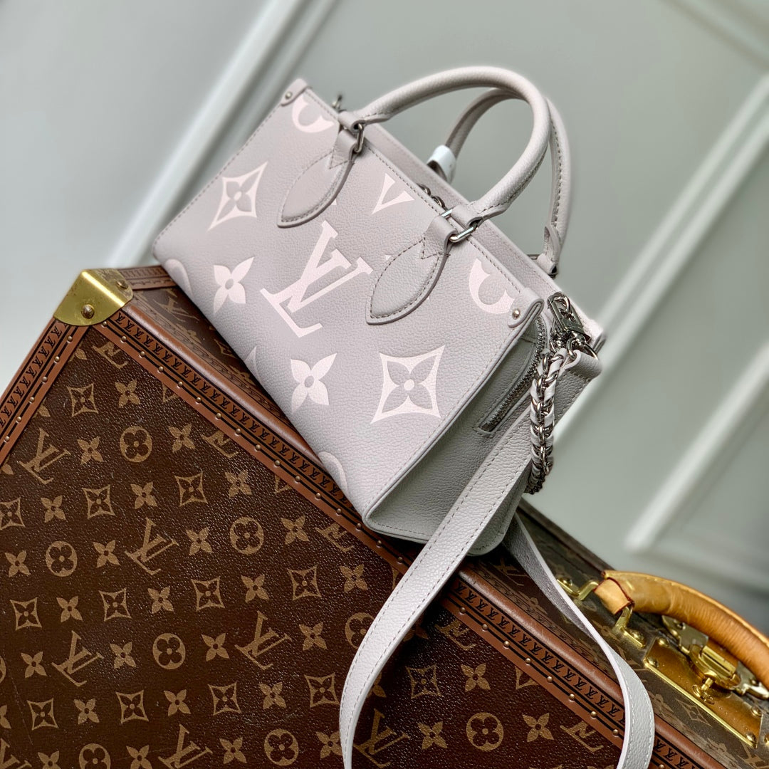 LOUIS VUITTON ONTHEGO EAST WEST BAG 25 IN BICOLOR MONOGRAM EMPREINTE LEATHER