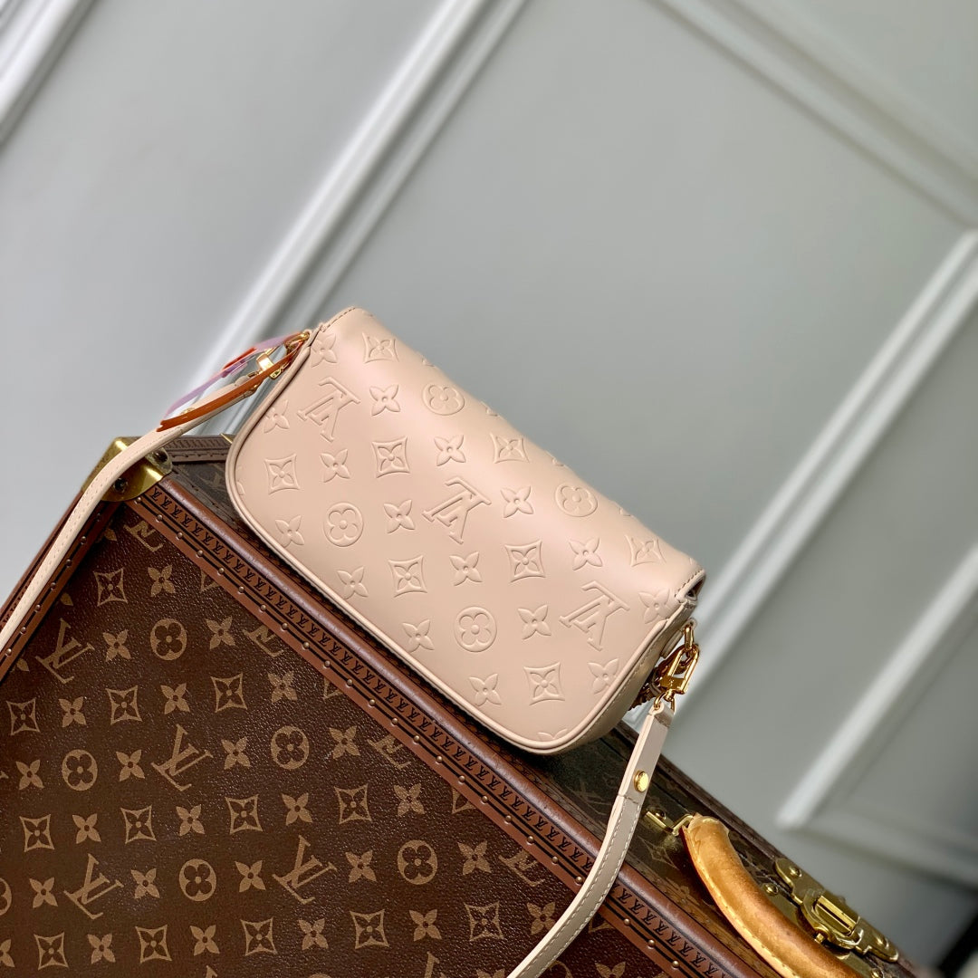 LOUIS VUITTON WALLET ON CHAIN IVY 23 IN BEIGE MONOGRAM REVERSE CANVAS EMBOSSED LOGO