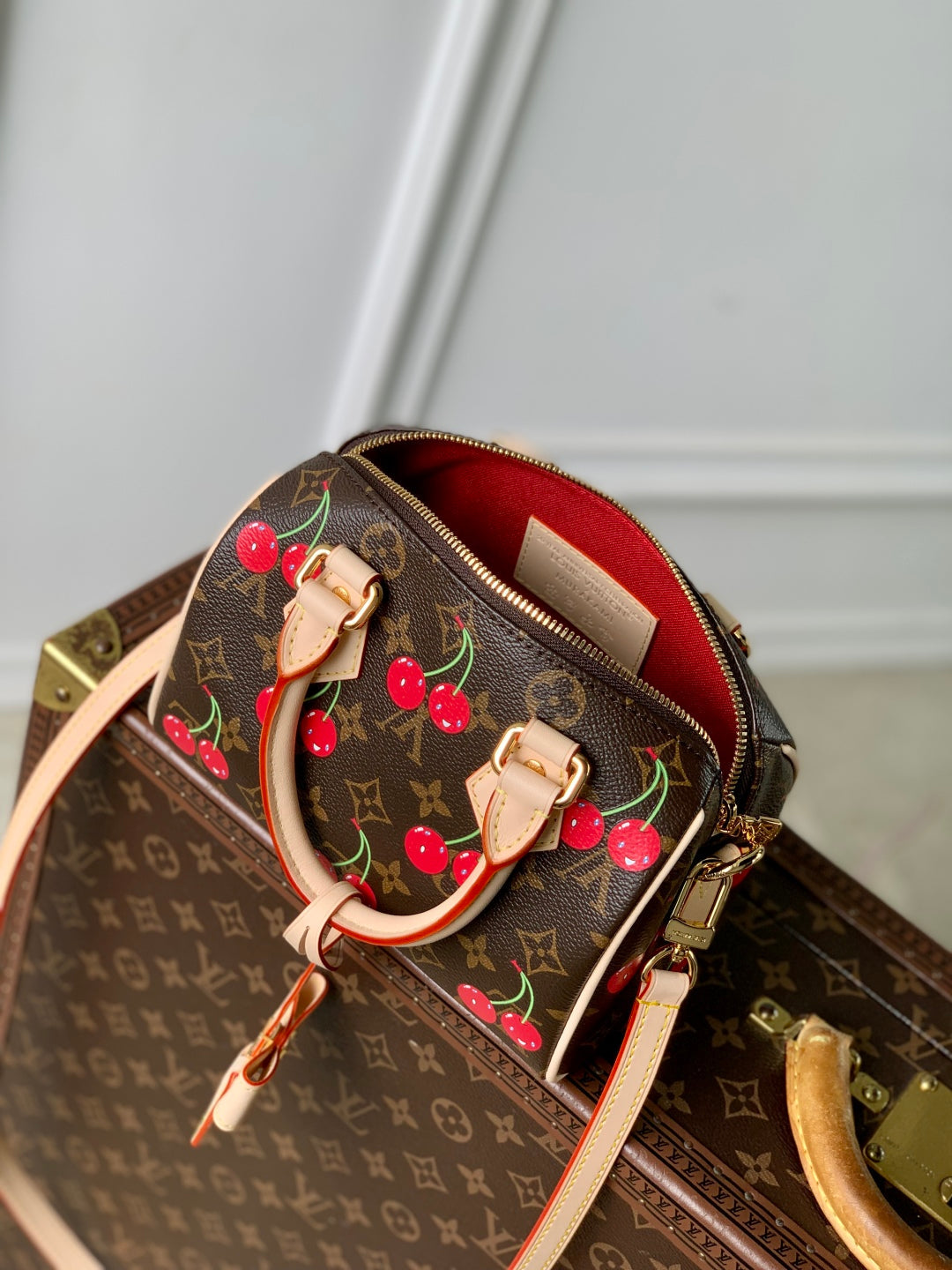 LOUIS VUITTON SPEEDY BANDOULIÈRE 20.5 BAG IN BROWN CANVAS CHERRY PRINTED