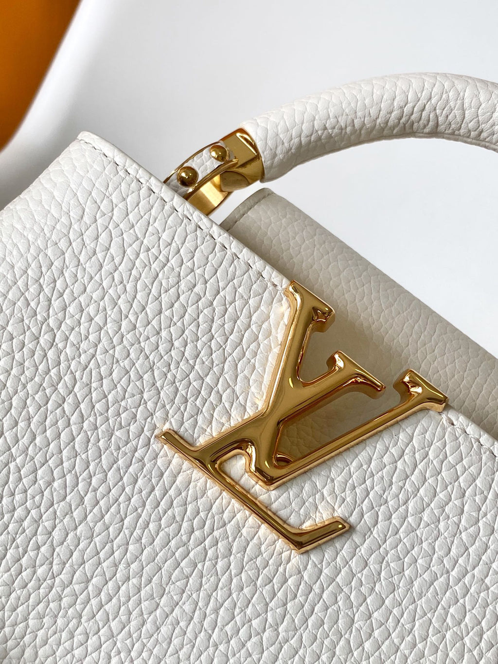 LOUIS VUITTON CAPUCINES EAST-WEST MINI 21 IN WHITE TAURILLON LEATHER GOLD-TONE HARDWARE