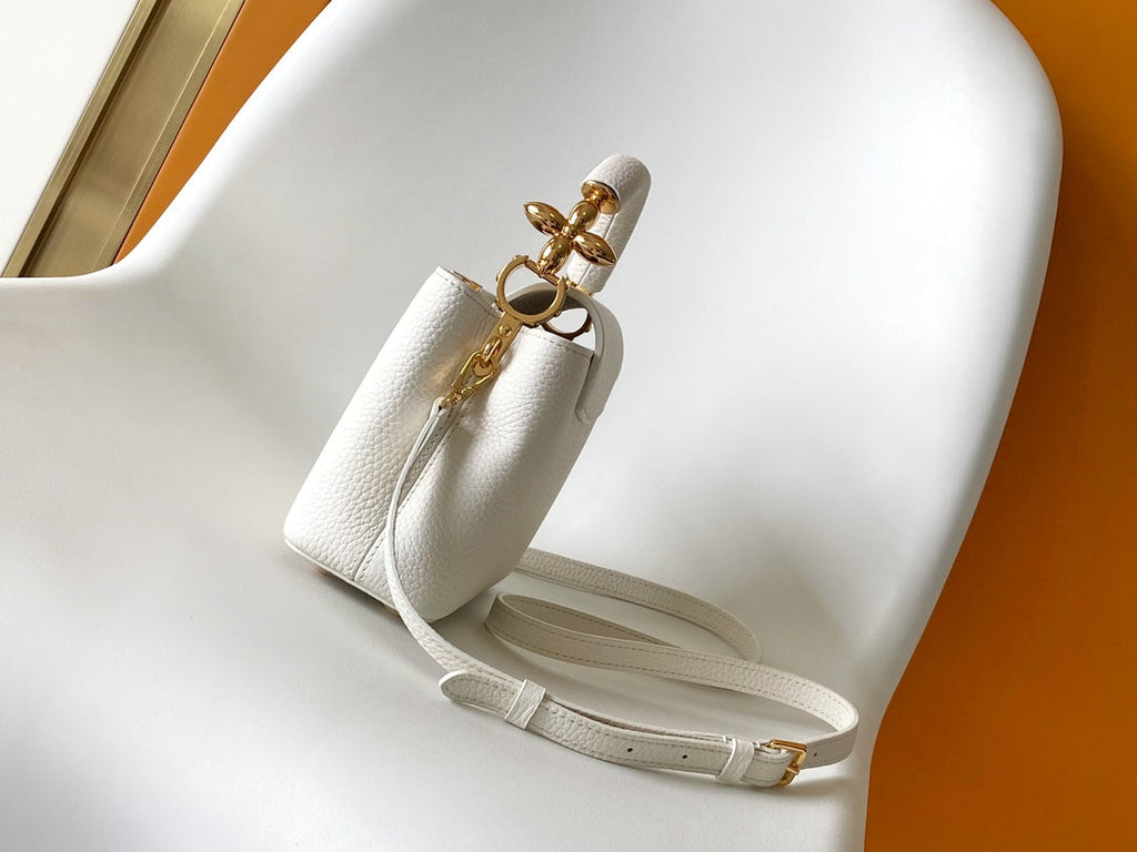 LOUIS VUITTON CAPUCINES EAST-WEST MINI 21 IN WHITE TAURILLON LEATHER GOLD-TONE HARDWARE