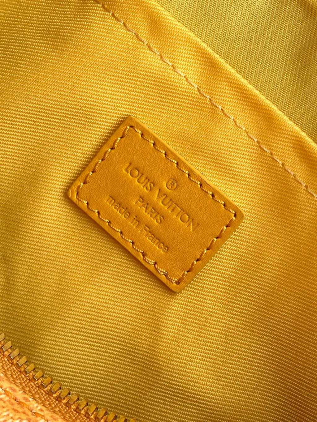 LOUIS VUITTON KEEPALL BANDOULIÈRE 25 IN ORANGE MONOGRAM HERITAGE CANVAS