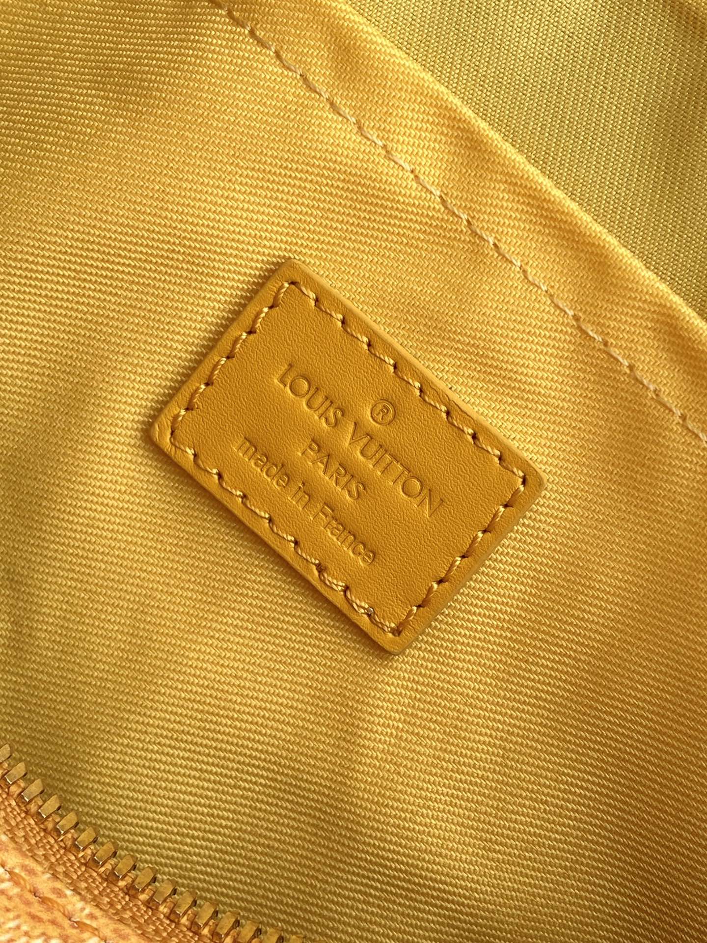 LOUIS VUITTON KEEPALL BANDOULIÈRE 25 IN ORANGE MONOGRAM HERITAGE CANVAS