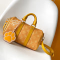 LOUIS VUITTON KEEPALL BANDOULIÈRE 25 IN ORANGE MONOGRAM HERITAGE CANVAS