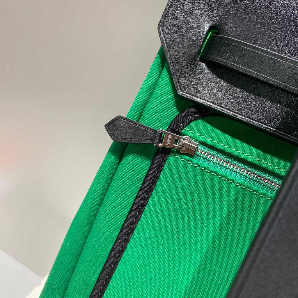 HERMES HERBAG A DOS ZIP RETOURNE BACKPACK 29 IN GREEN CANVAS AND BLACK CALFSKIN