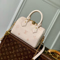 LOUIS VUITTON SPEEDY BANDOULIÈRE 20.5 IN LIGHT PINK MONOGRAM EMPREINTE CANVAS
