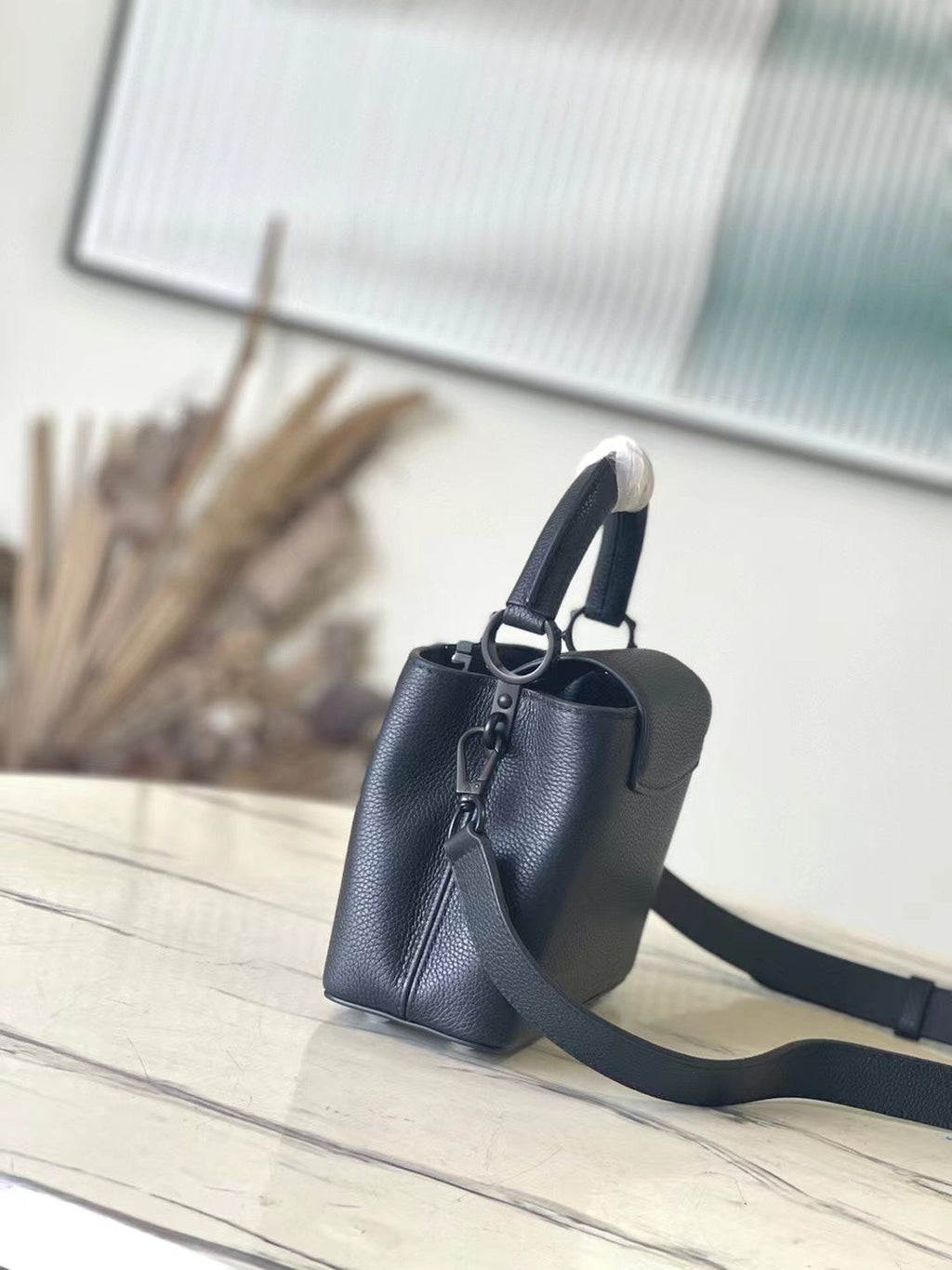 LOUIS VUITTON CAPUCINES EAST-WEST MINI 21 IN BLACK TAURILLON