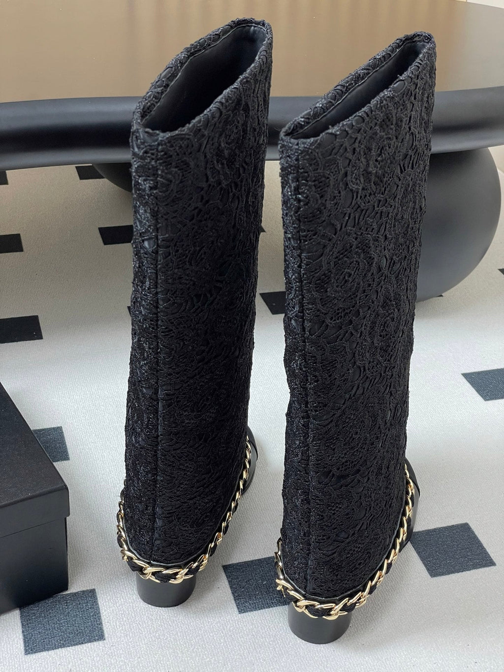 CHANEL FLORAL BOOTS 60MM IN BLACK CALFSKIN WITH GOLD CHAIN