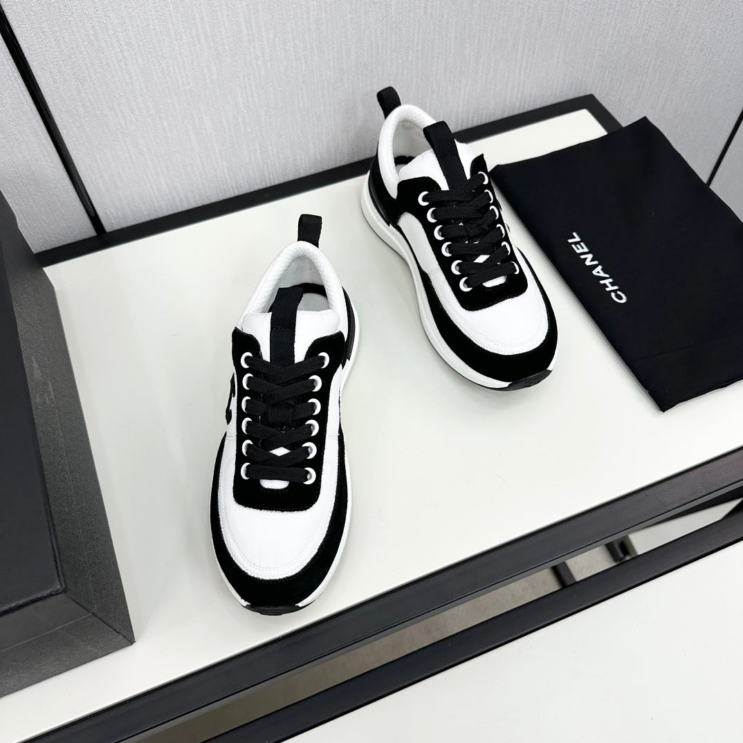 CHANEL SNEAKER IN BLACK SUEDE AND WHITE CALFSKIN